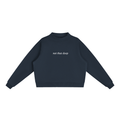 Navy blue Not That Deep oversized mock-neck sweatshirt front view with small ivory lettering centered on the chest.