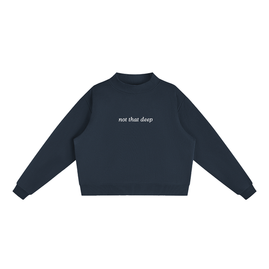 Navy blue Not That Deep oversized mock-neck sweatshirt front view with small ivory lettering centered on the chest.