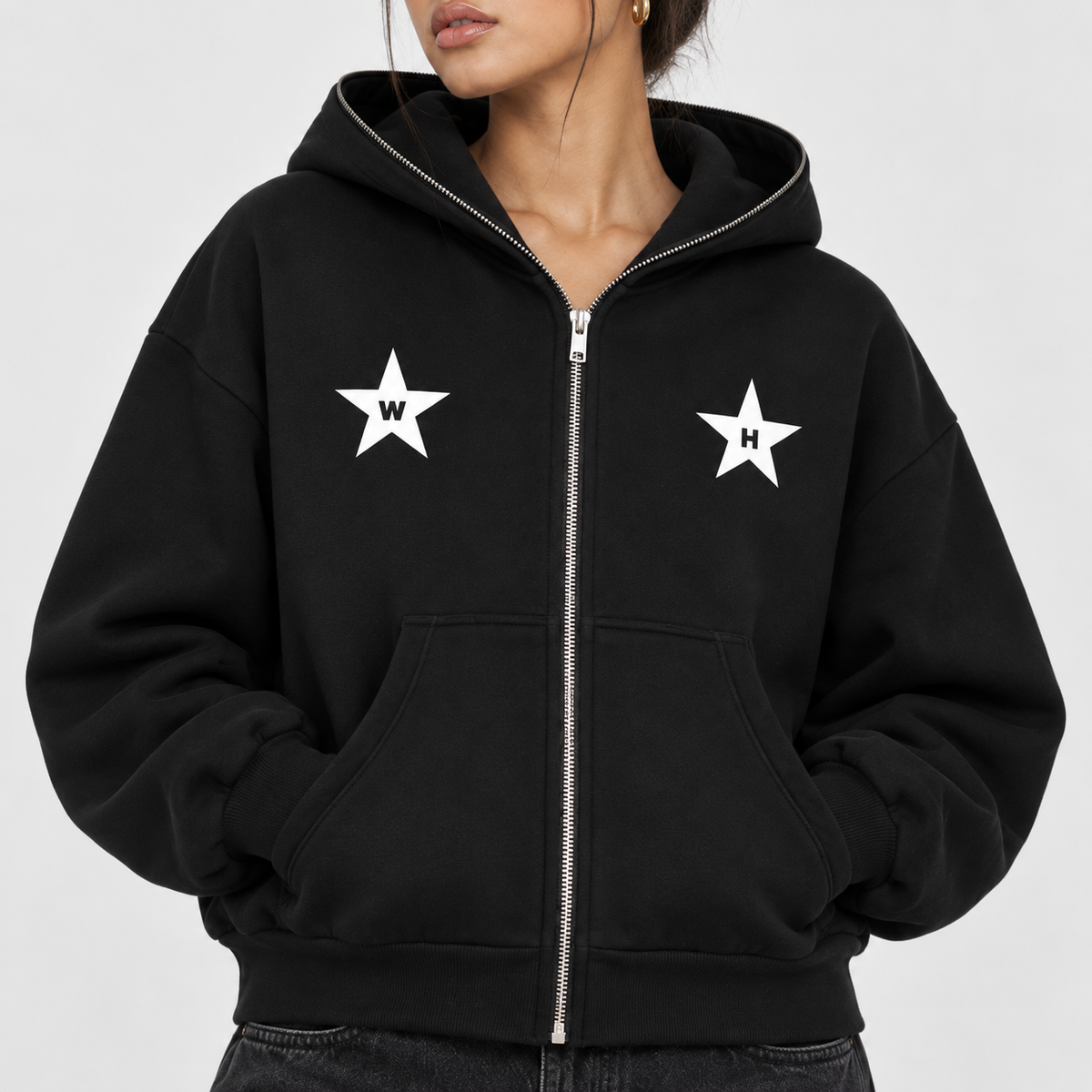 Close-up of black Bloom Full-Zip Hoodie with front chest graphics and zipper