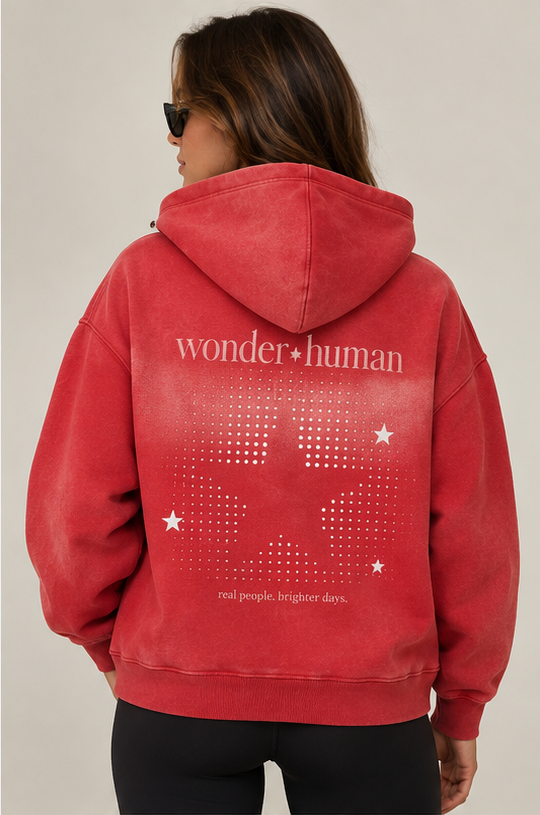 Model wearing red Ember Two-Way Zip Hoodie, back view with Wonder Human graphic