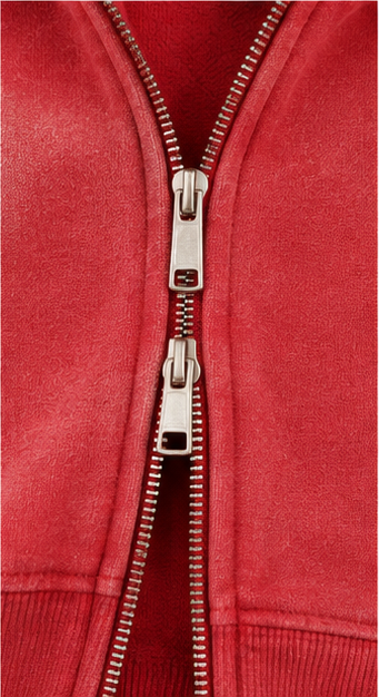 Close-up of red Ember Two-Way Zip Hoodie showing two-way zipper and washed fabric texture