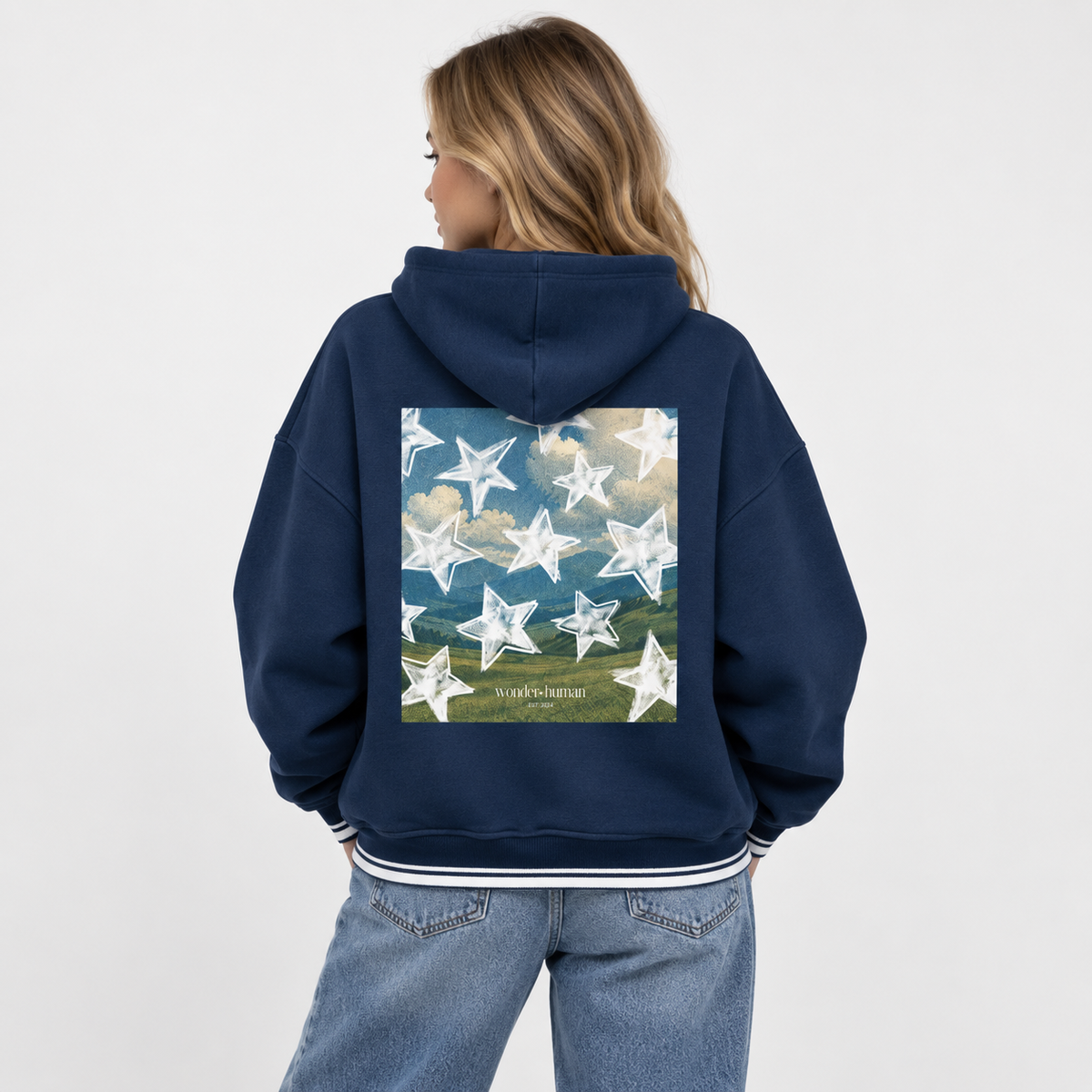 Female model wearing Star Field Colorblock Hoodie back view showing graphic