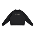 Black Not That Deep oversized mock-neck sweatshirt, front view with small ivory chest lettering.