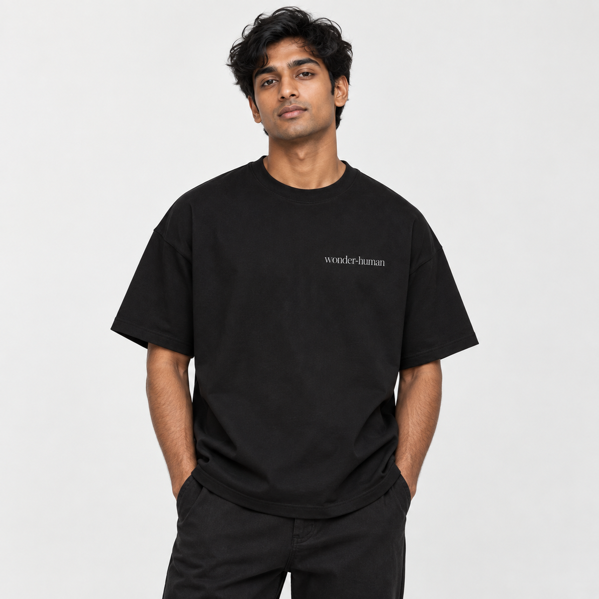 Male model wearing black Star Field Tee, front view